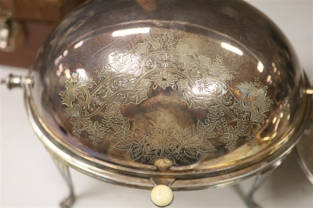 A good quality late 19th century silver-plated warming dish, of clover form, with a shaped cover,